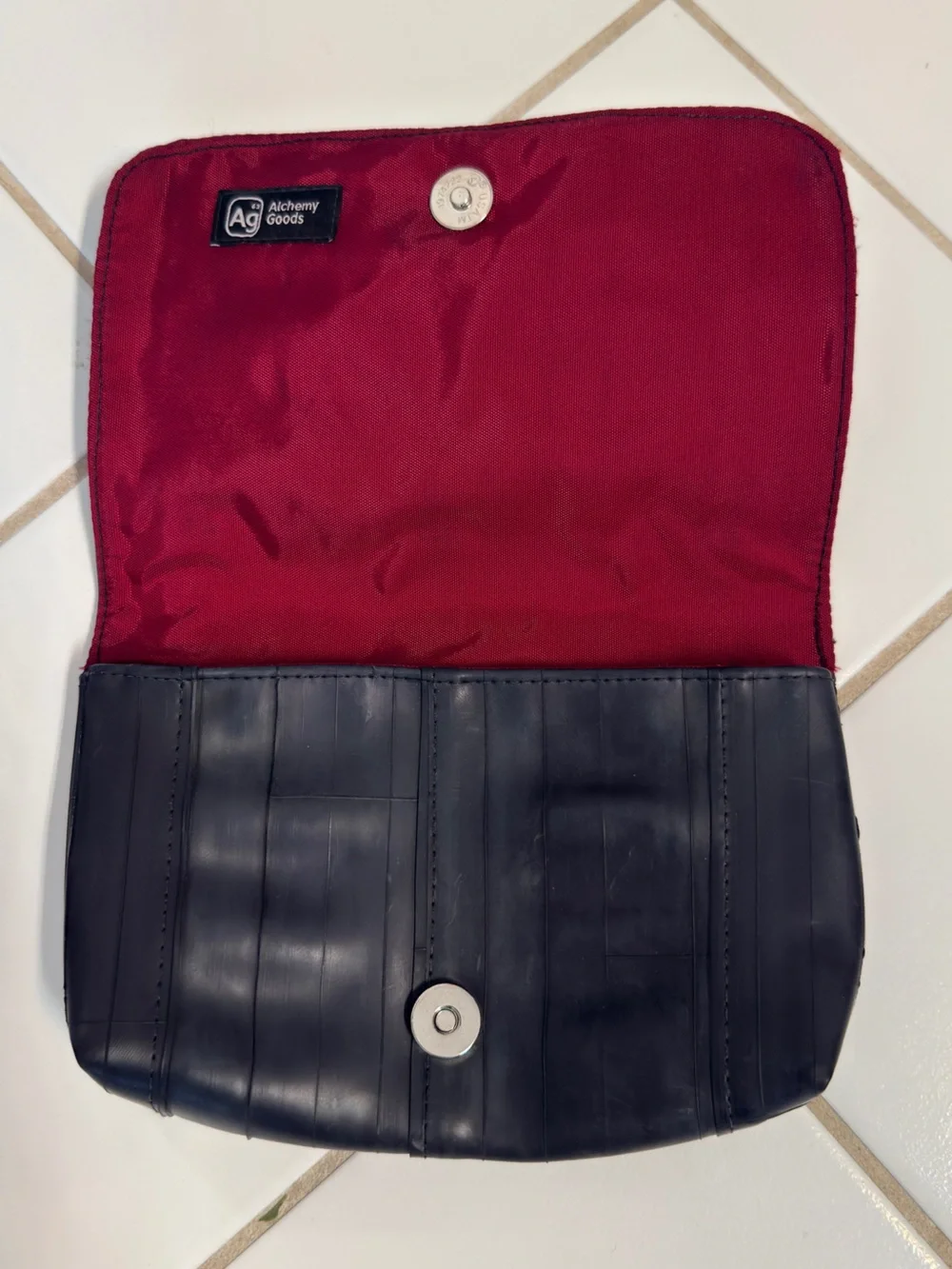 Recycled tire Broadway clutch with burgundy interior
